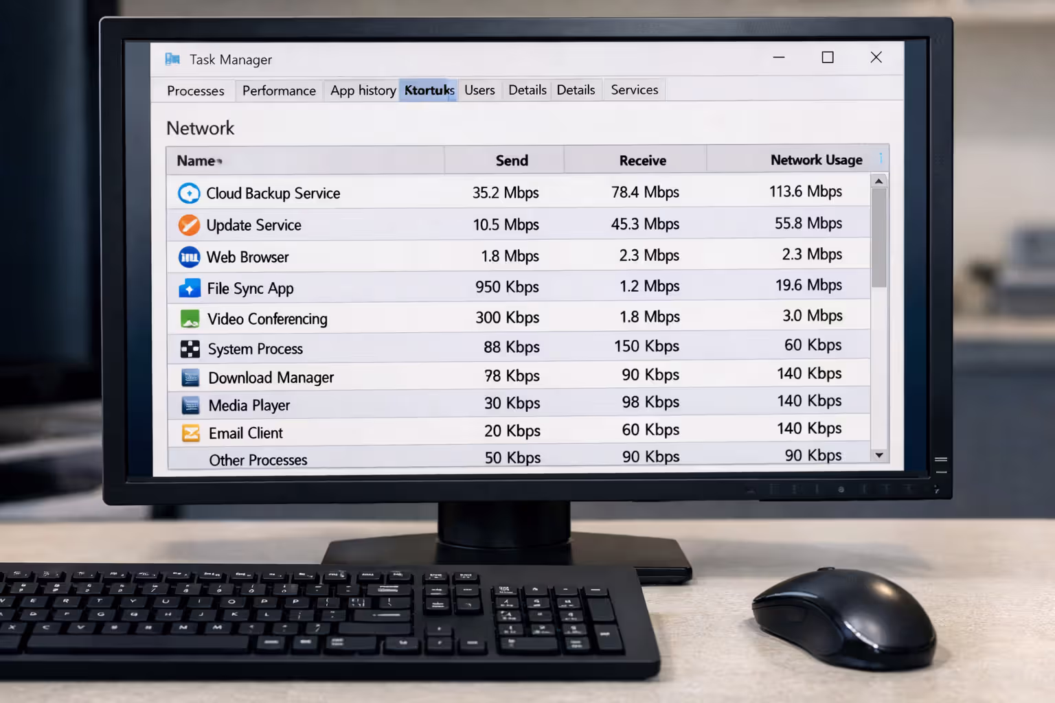 Computer monitor displaying Task Manager network tab showing bandwidth-consuming background processes like cloud backup and system updater with high network usage values in a clean desktop setup